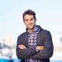 smile-crossed-arms-portrait-man-harbor-travel-vacation-adventure-holiday-happy-outdoor-confident-person-by-sea-port-weekend-trip-cape-town-with-positive-attitude_590464-327859